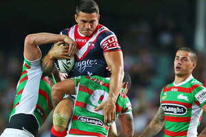 Sonny Bill Williams is tackled in last week's NRL opener against the Rabbitohs. Photo /Getty Images