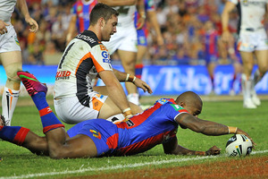 Akuila Uate scores a try in Newcastle's opening round win over the Wests Tigers. Photo / Getty Images