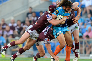 Ryan James of the Titans attempts to push through the Sea Eagles defence. Photo / Getty Images