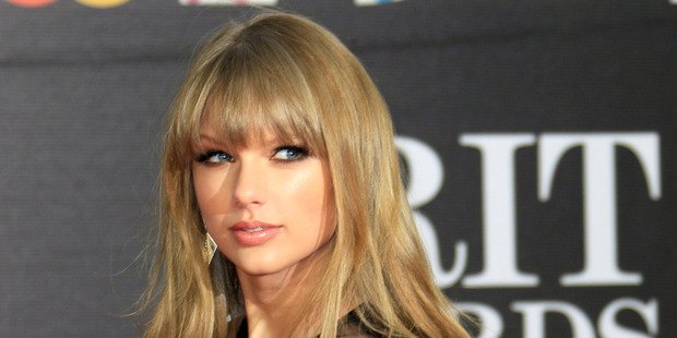 Taylor Swift is reportedly pursuing American pro surfer John John Florence via text-messaging. Photo / AP, Getty Images
