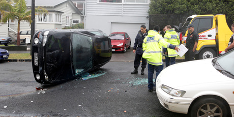 Police are investigating whether rain was a factor in this crash at Bungalow Ave in Pt Chevalier yesterday. Photo / Chris Gorman