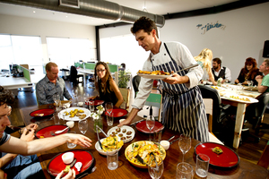 Ben Barton cooked a vegetarian meal for 32 people using food thrown out by supermarkets. Photo / Dean Purcell