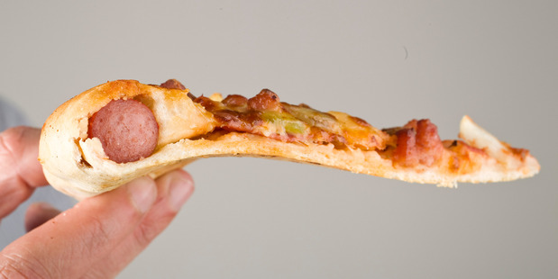 It looks like a pizza, but that's a hot dog baked into the crust ... with sauce. Photo / Michael Craig