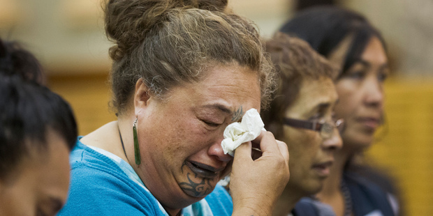 An emotional moment for Huka Williams as the Tuhoe delegation arrives at the Grand Hall in Parliament for the deed of settlement signing yesterday. Photo / Mark Mitchell
