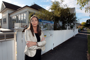 Sally Hughes of the Save Our St Heliers lobby group outside a Goldie St property. Photo / Doug Sherring