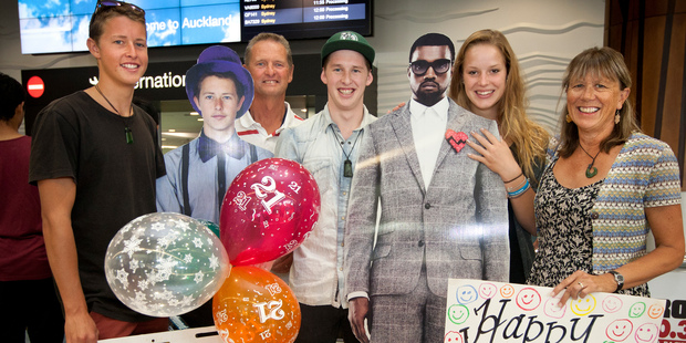 Steve Everitt and wife Sheryl, with son Lucas (left) and German exchange student Ebba Korth, welcome their other son Matt (centre) back home from the UK. Photo / NZ Herald