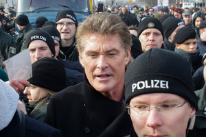 US actor David Hasselhoff, center, is surrounded by police officers as he attends a protest against the removal of a section of a historic part of the former Berlin Wall. Photo / AP