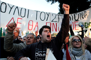 Protesters chant slogans outside the Cypriot Parliament against a vote on a plan to seize part of depositors' bank savings. Cypriots want to avoid treading in Greece's footsteps. Photo / AP