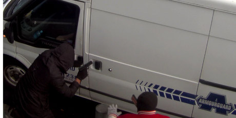 A CCTV camera captured the armed pair's failed attempts to get into the van. Photo / supplied