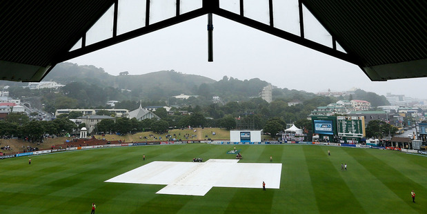 The covers sit on the pitch during a rain delay at the Basin Reserve. Photo /Getty Images