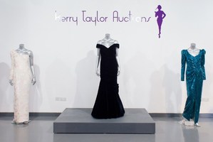 Dresses worn by Princess Diana (L-R) a Catherine Walker ivory crepe gown, a Victor Edelstein evening gown and another Catherine Walker evening gown.Photo / AFP