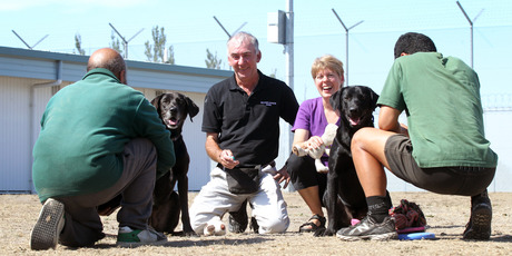 Two prisoners with their pets named Jet and Benny, pictured with Steve Dunworth from Second Chance Dogs and Adopt A Dog director Trina Bergloff-Howes. Photo / Duncan Brown