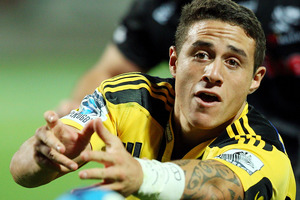 Hurricanes backs Conrad Smith and TJ Perenara (pictured) have both come through training today and will take their place in the Hurricanes starting XV on Saturday. Photo / Getty Images.