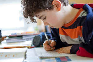 New Zealand needs a national set of guidelines for homework levels, says a PTA leader. Photo / Getty Images