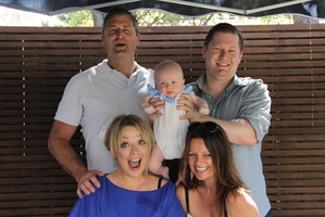 Dougal (top right), Hayley (bottom left), and son Oscar, with his godparents at Oscar's naming ceremony. Photo / Supplied