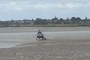 Crew from the police helicopter scooped the boy from the harbour mudflats.