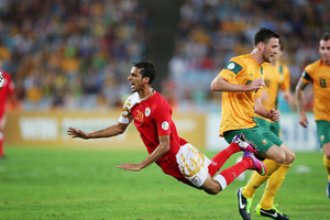 Amad Al Hosni of Oman is brought down after a challenge from Robbie Cornthwaite. Photo / Getty Images