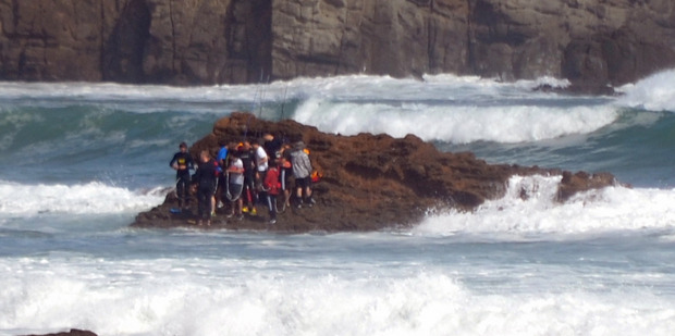 A group of fishermen cut off by a rising tide near Port Waikato have been saved in a daring mass rescue. Photo / Glennys Smith/Supplied