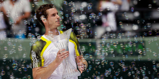 Andy Murray, of Britain, holds the trophy after defeating David Ferrer of Spain in the Sony Open Tennis Tournament. Photo / AP