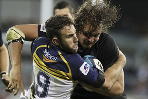 Wimpie van der Walt of the Kings is tackled during the round eight Super Rugby match between the Brumbies and the Kings. Photo / Getty Images.