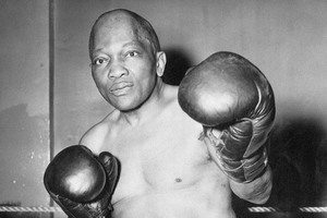 Jack Johnson, shown here in 1945 at the age of 67, was "railroaded" by authorities, say his family. Photo / AP