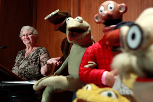 Jane Henson, left, with some of Jim Henson's earliest puppets, including the original Kermit. Photo / AP