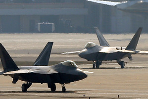 Two U.S. Air Force F-22 Raptor stealth fighter jets wait to take off during a military exercise at the Osan U.S. Air Base in Pyeongtaek, south of Seoul. Photo / AP