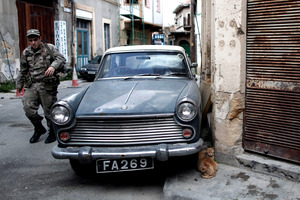 A Greek Cypriot soldier patrols the old town of the capital, Nicosia. Photo / AP