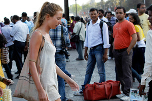 German tourist Carolina De Paola, 22, walks near the landmark Gateway of India in Mumbai, India. Photo / AP