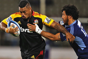 While the Chiefs couldn't get their attacking game flowing, their defence shut down the Blues as they made 150 tackles and missed just 15. Photo / Getty Images