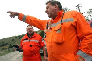 Rural fire officer Porky Sexton and Wairarapa principal rural fire officer Phill Wishnowsky discuss the fire. Photo / Wairarapa Times- Age