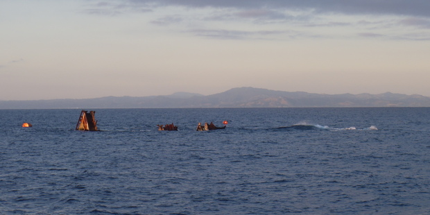 The remnants of the Rena carbo ship is seen off the Tauranga coast. Photo / Supplied