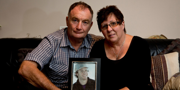 John and Jeanette McClean with a photo of their teacher son Tony, who perished. Photo / Dean Purcell