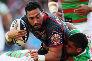 South Sydney players stop Warrior Feleti Mateo during their clash at Mt Smart Stadium last weekend. The Rabbitohs won 24-22. Photo / Getty Images