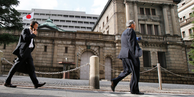 Last week, the Bank of Japan announced an aggressive QE program and monetary policy to tackle deflation and end decades of tepid growth. Photo / AP