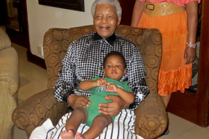 Nelson Mandela holding his great grandson Zen Manaway at home in Johannesburg, South Africa.Photo / AP