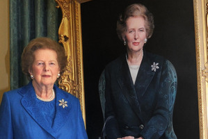 Former Prime Minister Margaret Thatcher, stands next to her portrait painted by artist Richard Stone, at 10 Downing St. Photo / AP