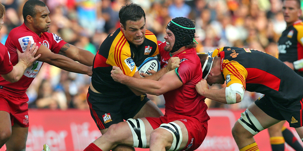 Richard Kahui is tackled during the Chiefs' Super 15 encounter against the Reds in Hamilton. Photo /Getty Images