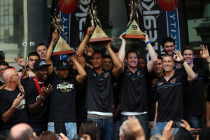 CJ Bruton, Mika Vukona and Dillon Boucher of the New Zealand Breakers hold up their Championship trophys from the last three years during a homecoming celebration. Photo / Getty Images.