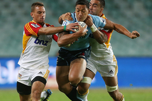 Israel Folau of the Waratahs is tackled during the round 10 Super Rugby match between the Waratahs and the Chiefs. Photo / Getty Images.