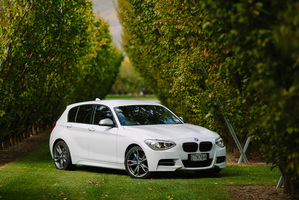 The more aggressive front and lower stance differentiate the M135i from 1 Series siblings. Photo / Simon Darby
