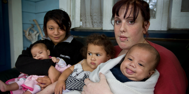 Tiana Levi (black jacket) is being hailed a hero for getting stepmother Daniella Lewis' babies Harmony, Keita and Sunnie to safety. Photo / Michael Craig