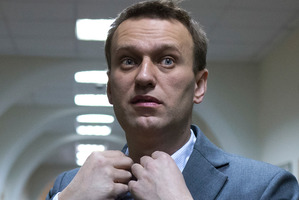 Russian opposition activist Alexey Navalny talks to journalists outside a courtroom in Moscow, Russia. Photo / AP