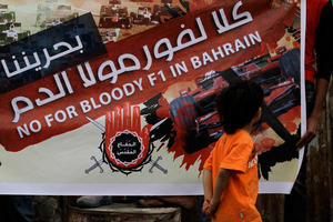 A poster in the Bahraini village of Malkiya highlights opposition to the grand prix, which protesters say is helping the country's repressive government. Photo / AP
