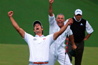 Adam Scott celebrates winning the US Masters, with caddie Steve Williams in the background and playoff runner-up Angel Cabrera behind him. Photo / AP Adam Scott celebrates winning the US Masters, with caddie Steve Williams in the background and playoff runner-up Angel Cabrera behind him. Photo / AP