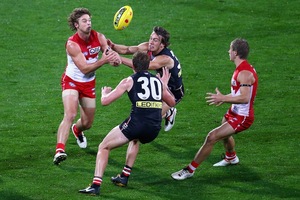 Dane Rampe of the Swans handballs during the round five AFL match between the St Kilda Saints and the Sydney Swans. Photo / Getty Images
