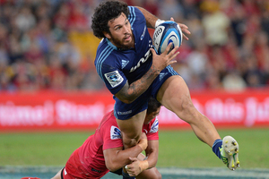 Rene Ranger of the Blues takes on the defence during the round 11 Super Rugby match between the Reds and the Blues. Photo / Getty Images.