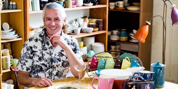 Avid Crown Lynn collector Robert Lloyd sits amongst his collection of 45 years. Photo / Babiche Martens