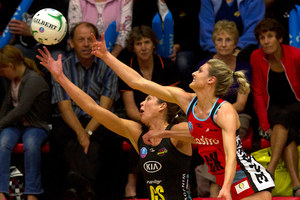 Tactix player Jane Watson (right) contests the ball with the Magic's Irene van Dyk in Tauranga last night. Photo / Alan Gibson