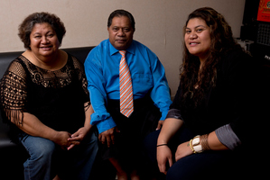 Helen Iopu celebrates her graduation with her parents Olaileipu and Taleni Iopu at their home. Photo / Dean Purcell